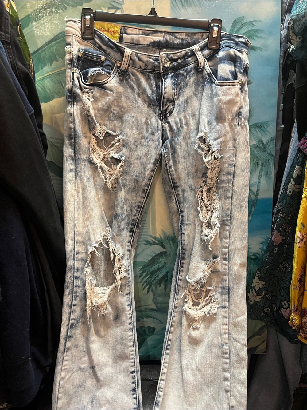 Y2k Machine Jeans featuring a heavily distressed, bleached acid-wash design 29